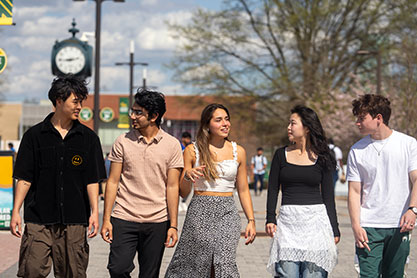 Students walking together. Links to Closely Held Business Stock Students walking together. Links to Closely Held Business Stock
