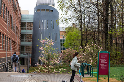 Student riding a scooter. Links to Tangible Personal Property Student riding a scooter. Links to Tangible Personal Property